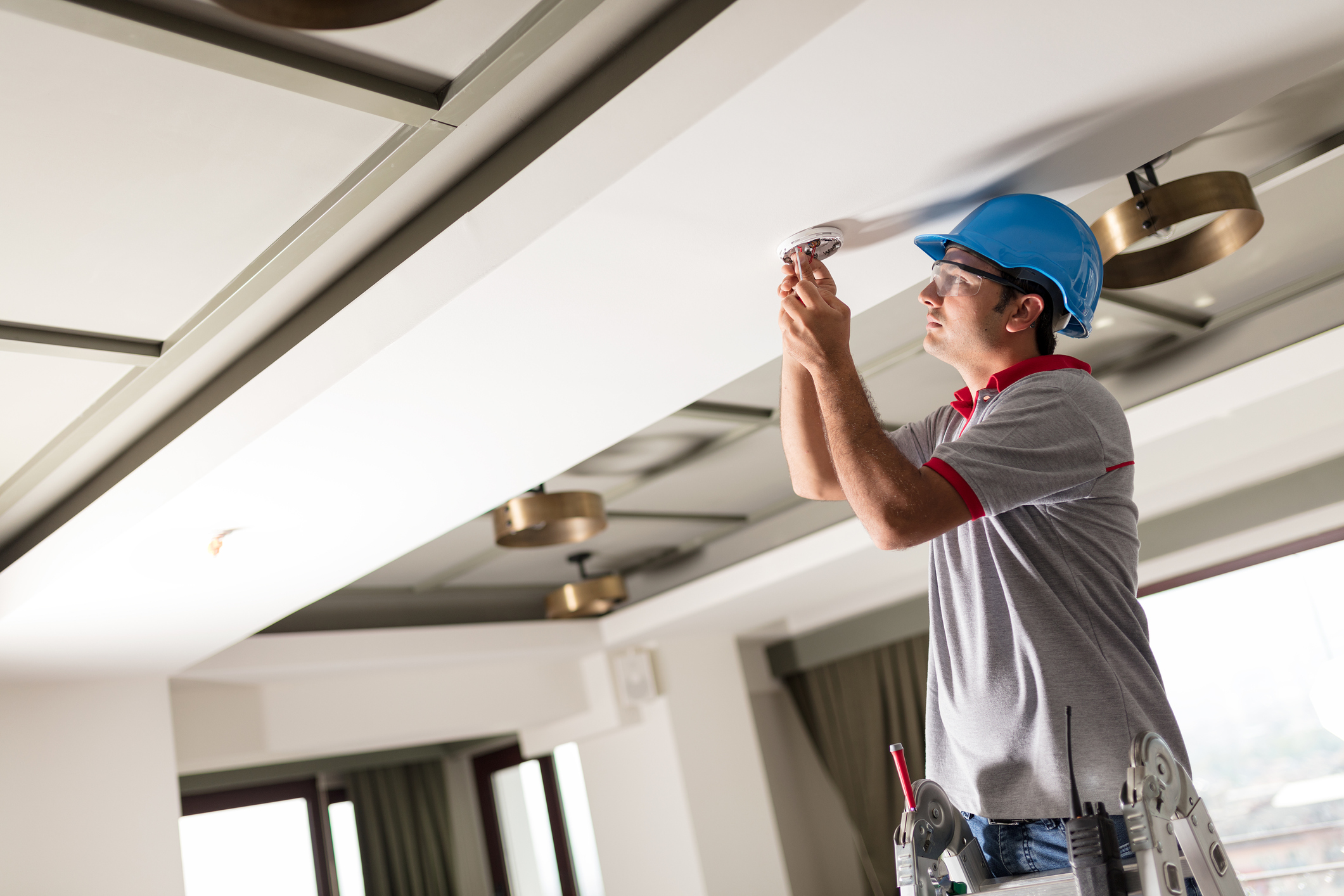 Man installing smoke detector